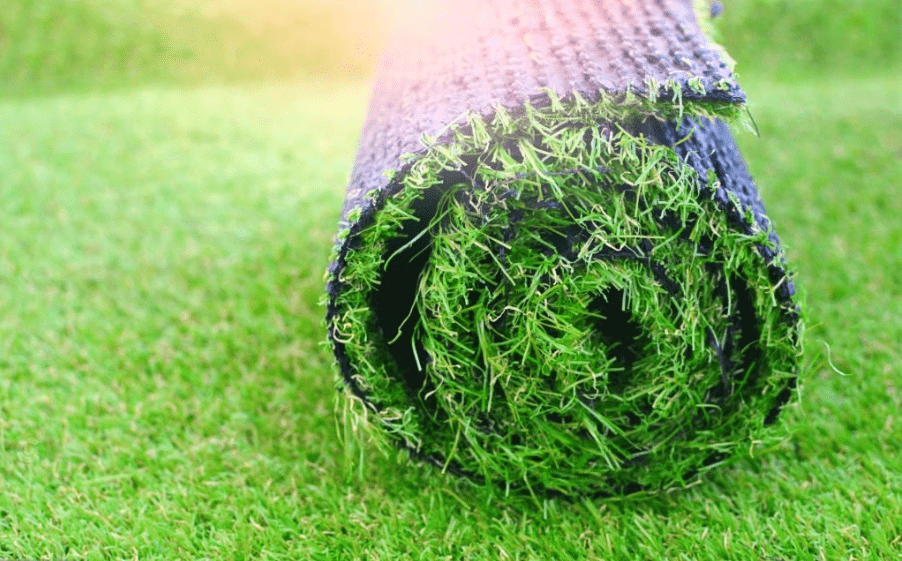 A artificial grass  roll lying on the grass