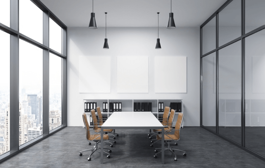 A office meeting room with a chair and table and wall painted with grey color