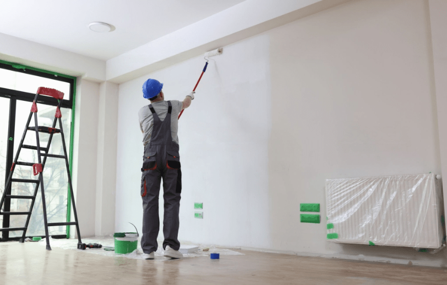  Men painted the office wall with paint roller